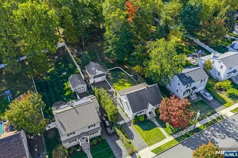 an aerial view of house with yard