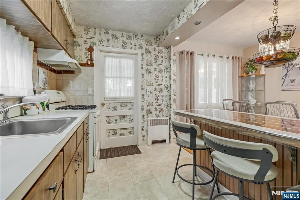 29 Lynwood Road Verona, NJ 07044 - Photo 10 of 39 a kitchen with granite countertop a sink and cabinets