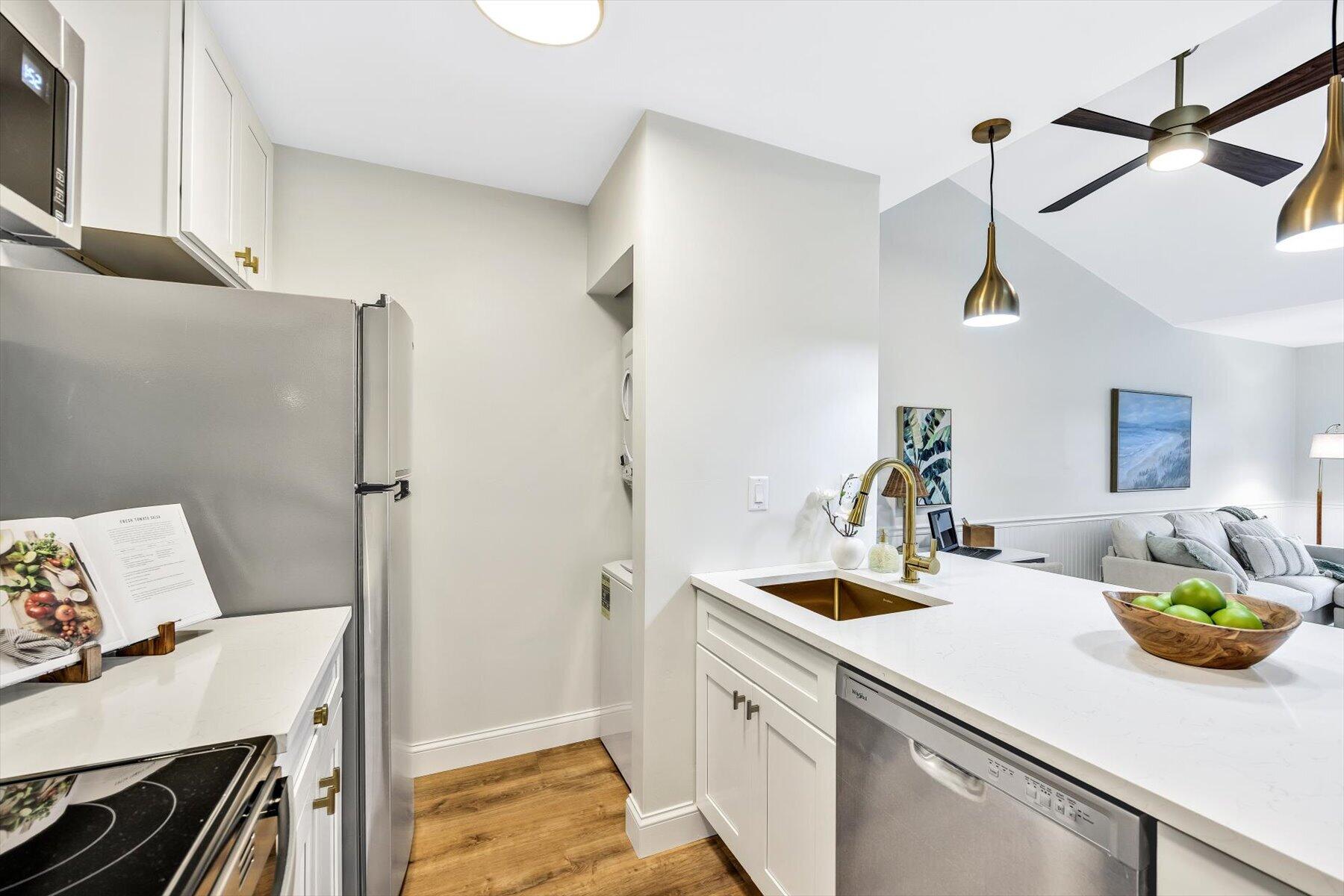 62 Fletcher Lane, Unit G Brewster, MA 02631 - Photo 10 of 30 a kitchen with a sink cabinets and appliances