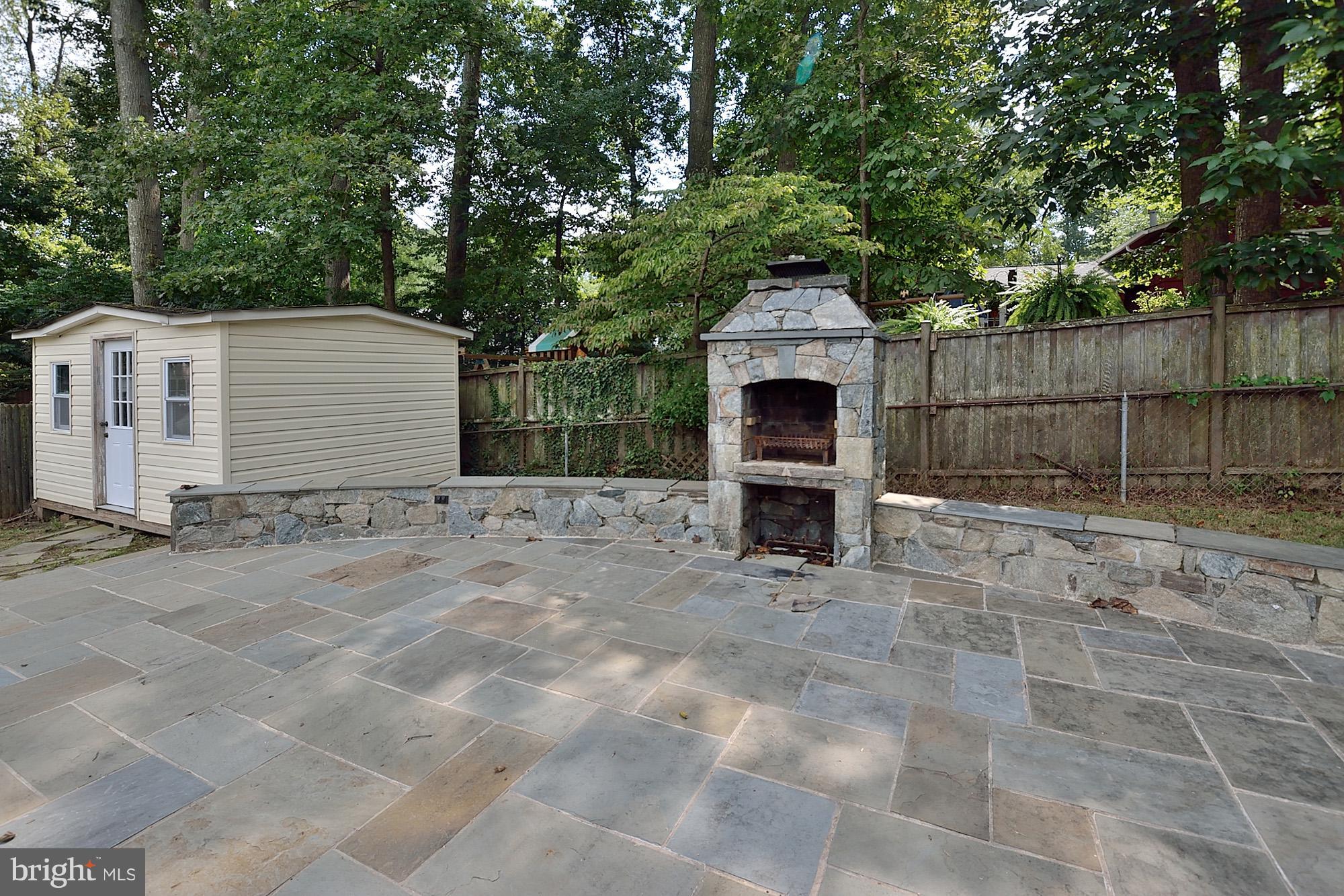 8115 Blairton Road Springfield, VA 22152 - Photo 26 of 29 Custom Rear Stone Patio with Storage Shed