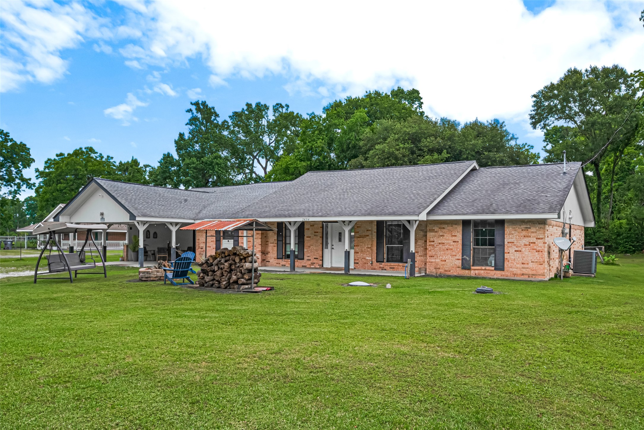 24314 Anderson Street Huffman, TX 77336 - Photo 5 of 48 front view of a house with a yard