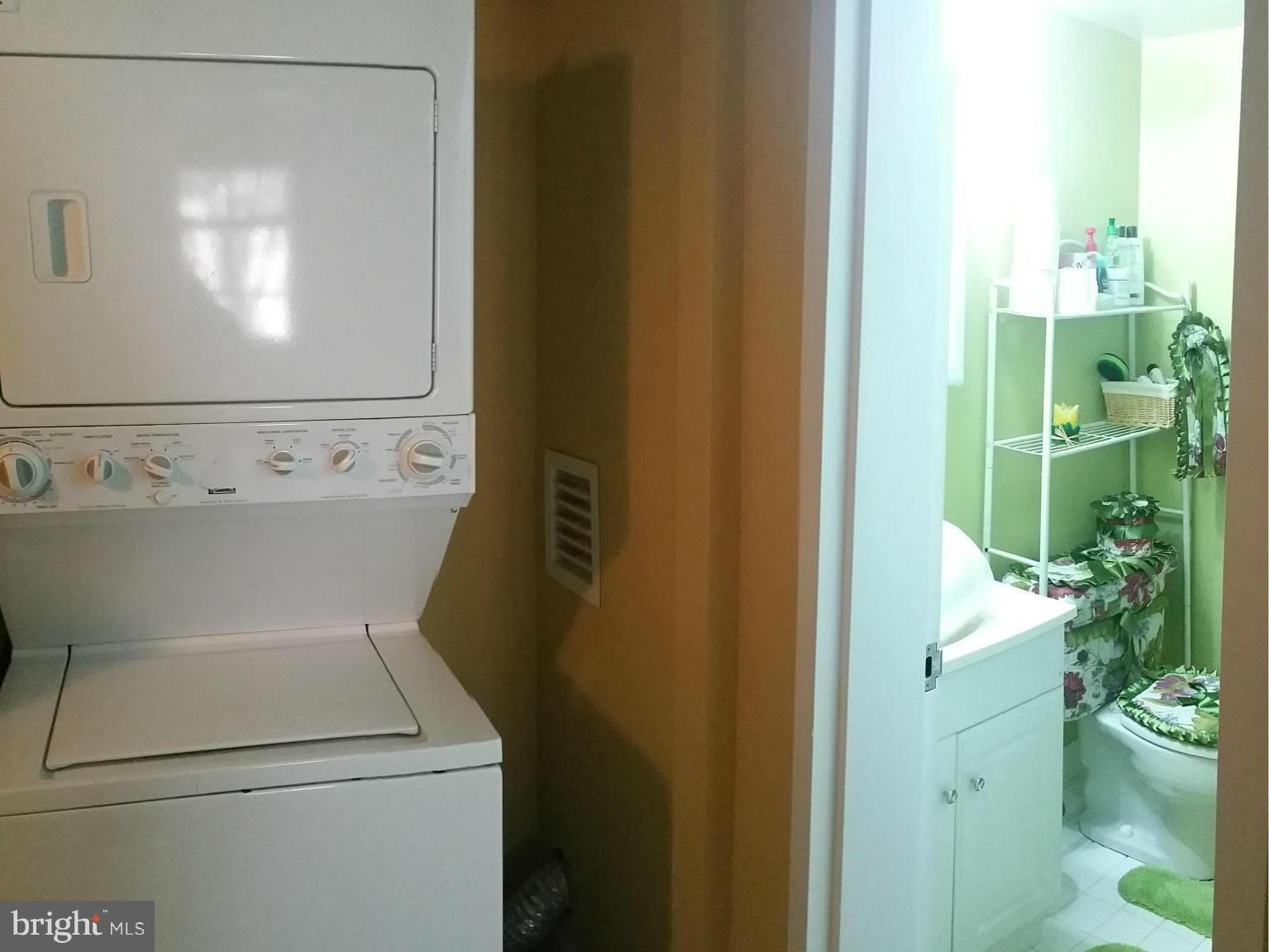 2234 Castle Rock Square, Unit 11C Reston, VA 20191 - Photo 14 of 30 a close up view of a washer and dryer