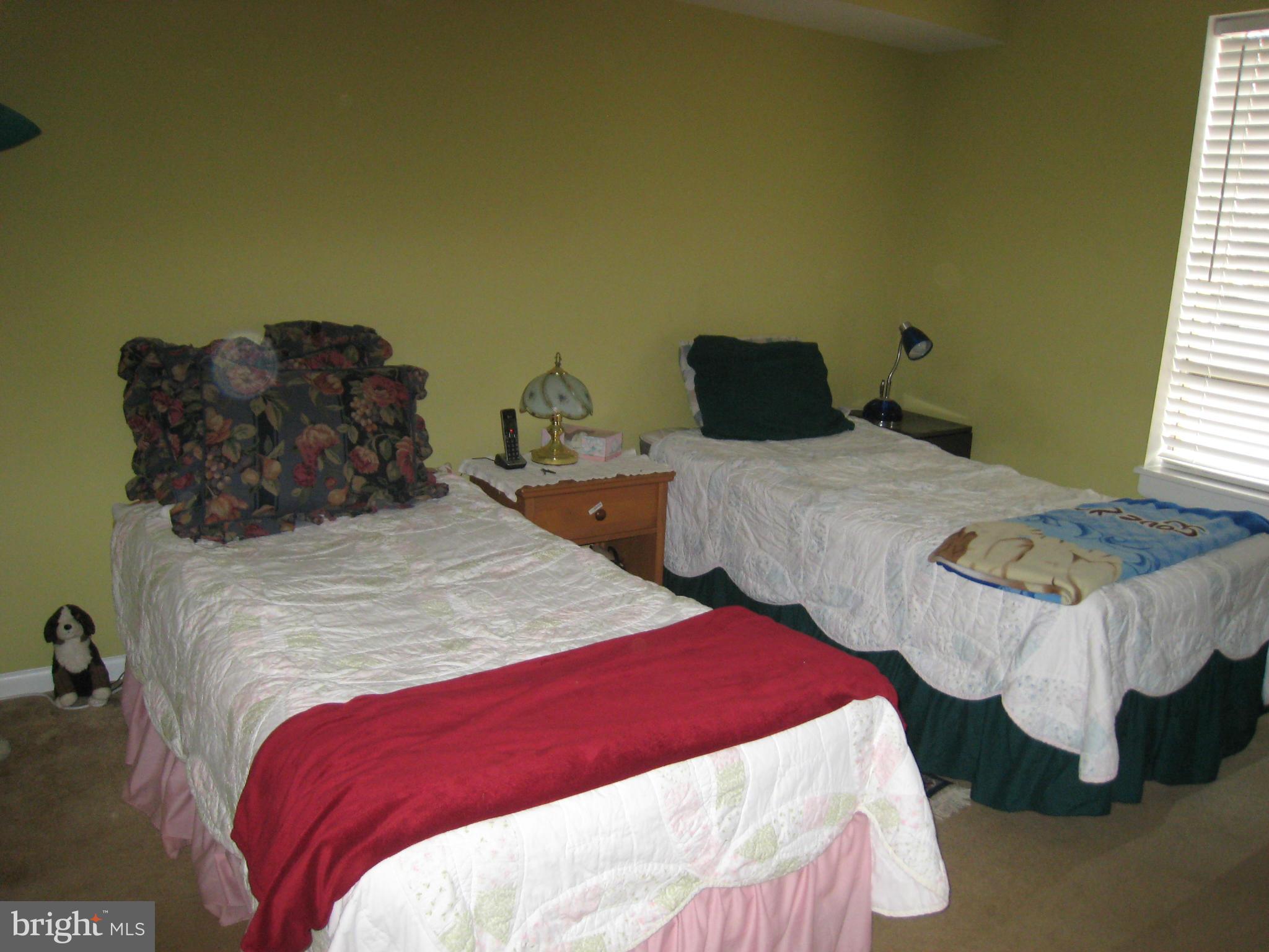 2234 Castle Rock Square, Unit 11C Reston, VA 20191 - Photo 17 of 30 a bedroom with two beds and a bed