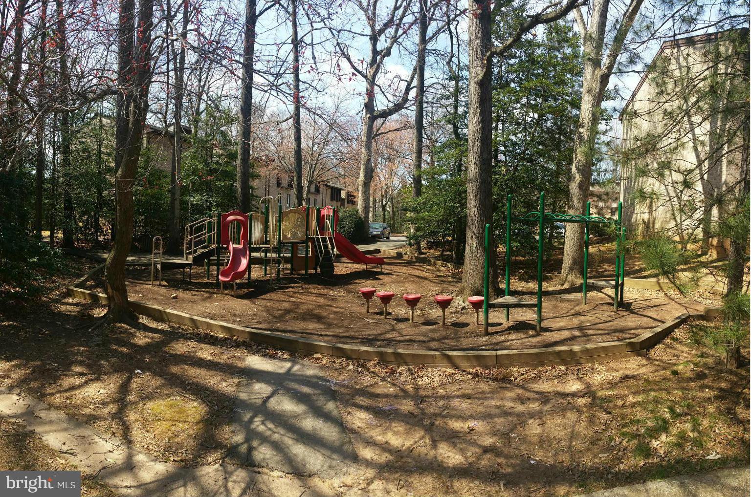 2234 Castle Rock Square, Unit 11C Reston, VA 20191 - Photo 28 of 30 a view of a park with swings and slides