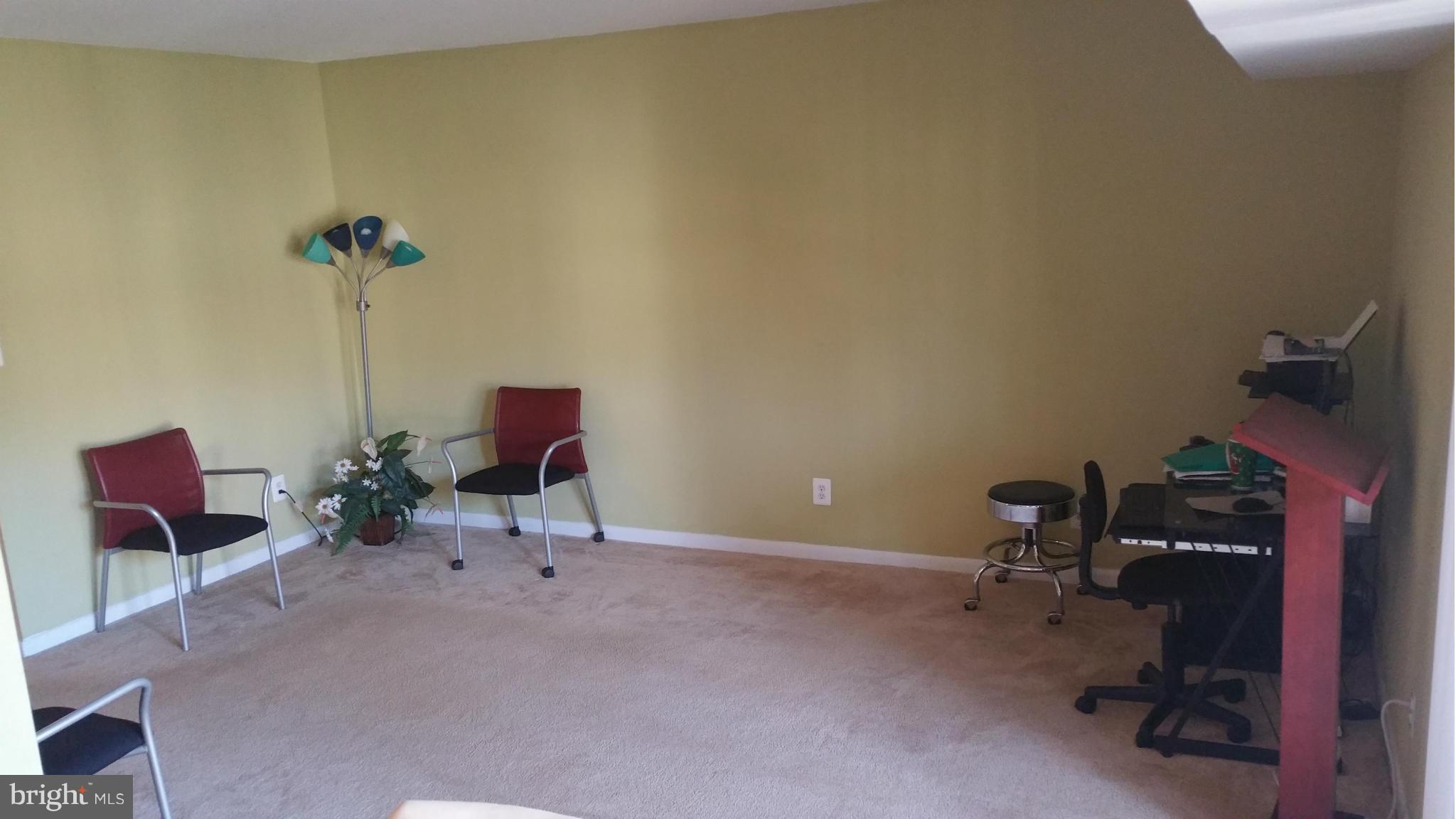 2234 Castle Rock Square, Unit 11C Reston, VA 20191 - Photo 10 of 30 a living room with furniture and a window