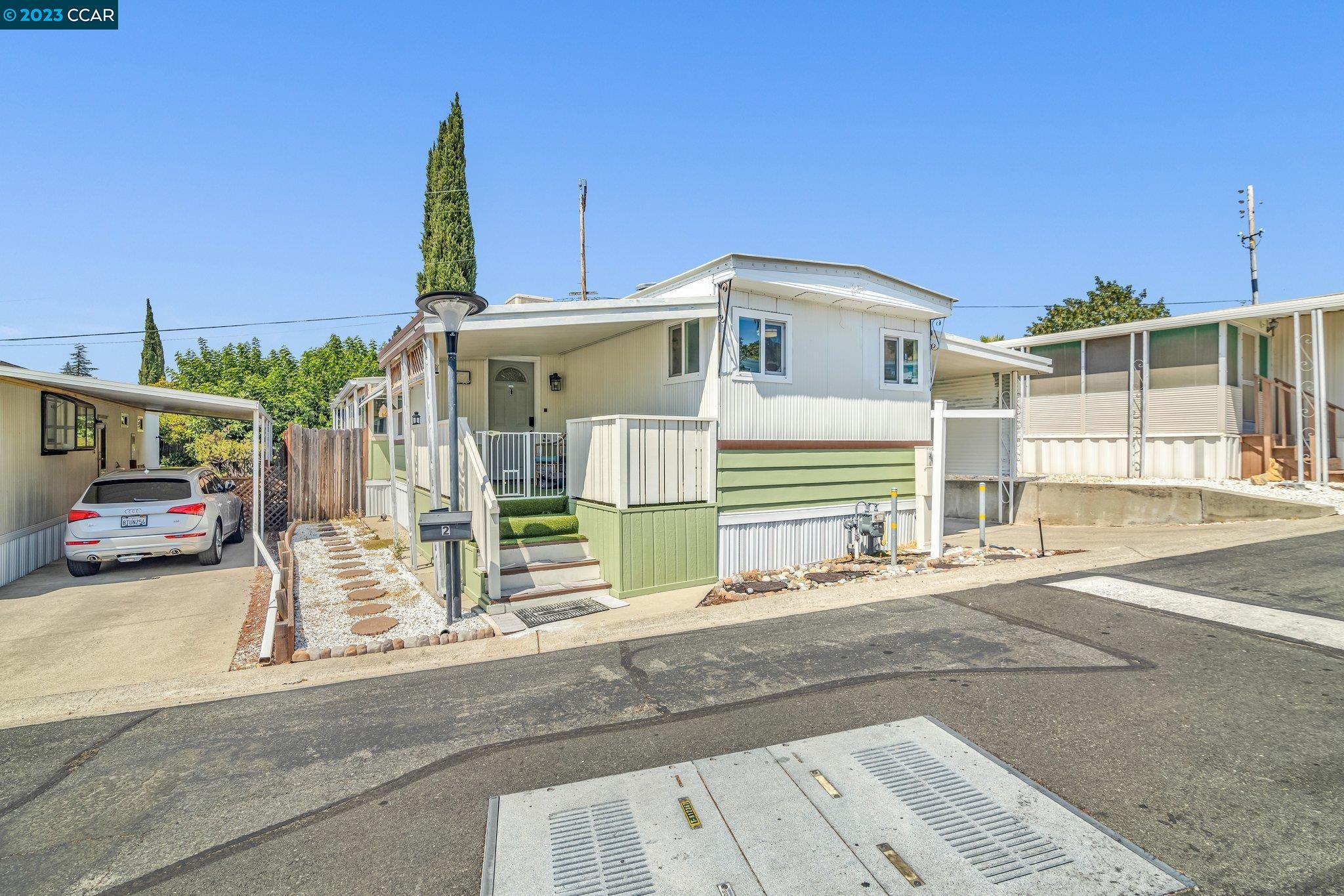 2 Terrace Drive Concord, CA 94518 - Photo 1 of 1 a front view of a house with a garden and parking