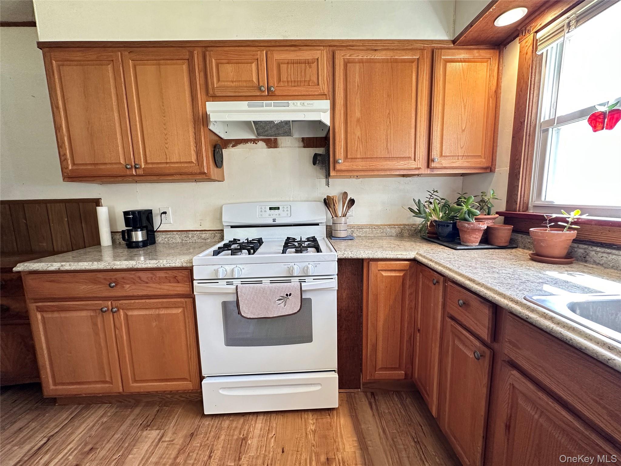 10 Upper Ferndale Road Liberty, NY 12754 - Photo 14 of 30 a kitchen with a sink a stove and cabinets