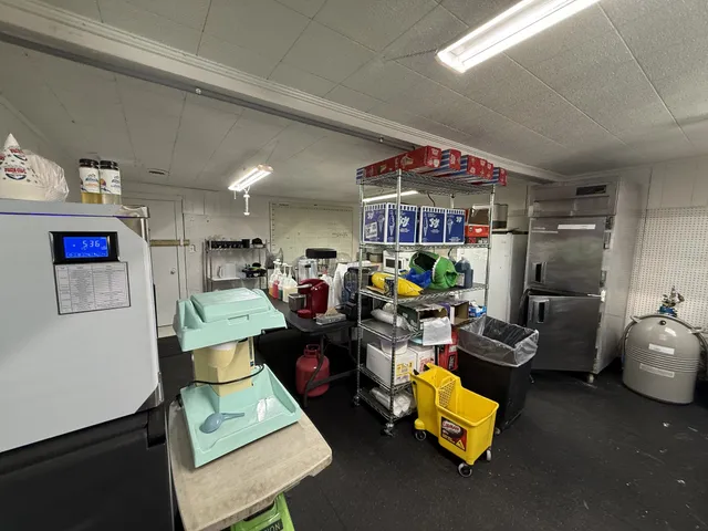 a living room with furniture a air conditioner and a window