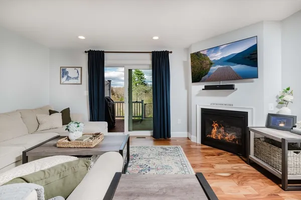 a bathroom with a granite countertop sink a toilet and a mirror