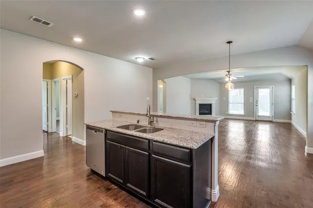a kitchen with center island table and chairs
