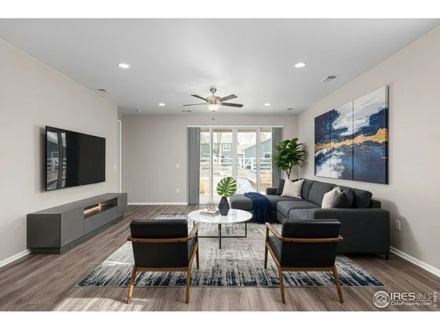 a view of kitchen with furniture and wooden floor