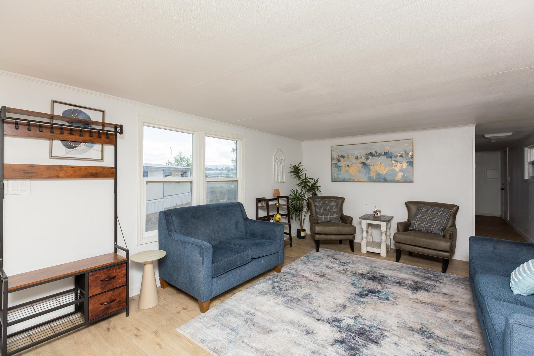 424 32 Road, Unit 112 Clifton, CO 81520 - Photo 5 of 41 a living room with furniture and a window