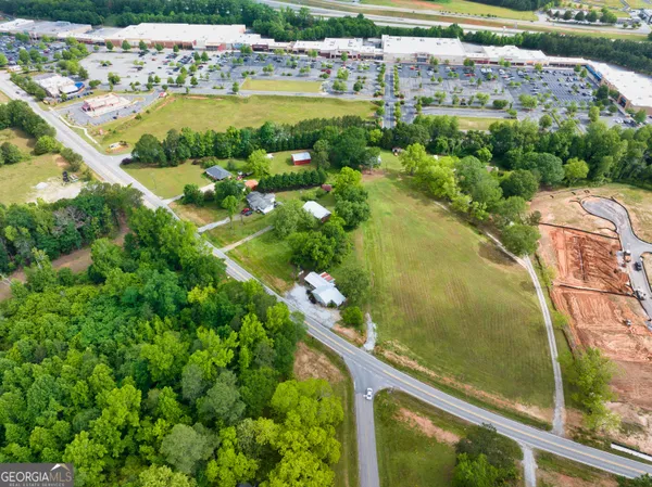 an aerial view of river residential houses with outdoor space and swimming pool