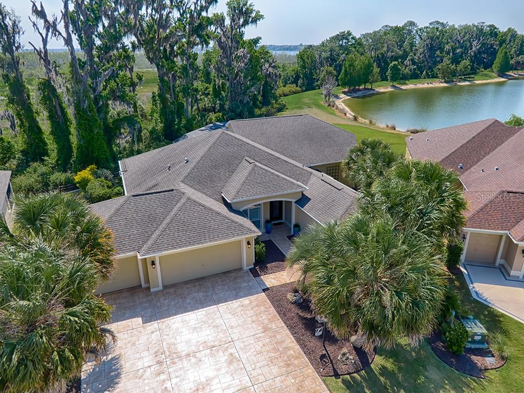 SPECTACULAR EXPANDED 3/3 GARDENIA WITH 3 CAR GARAGE, LAKE AND PRESERVE VIEW WITH POOL & SPA IN THE VILLAGE OF LAKE DEATON!