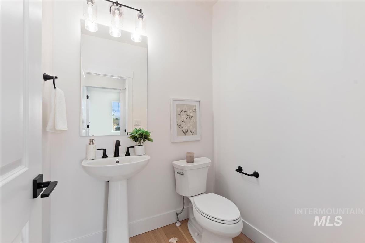 2126 East Blakehurst Street Kuna, ID 83634 - Photo 21 of 21 Half bathroom featuring toilet and wood finished floors