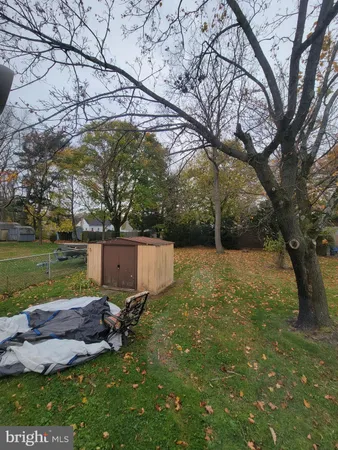 a view of a backyard with a bench
