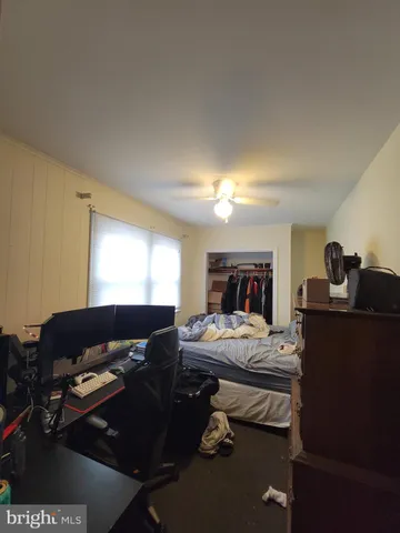 a living room with furniture flowerpot and window