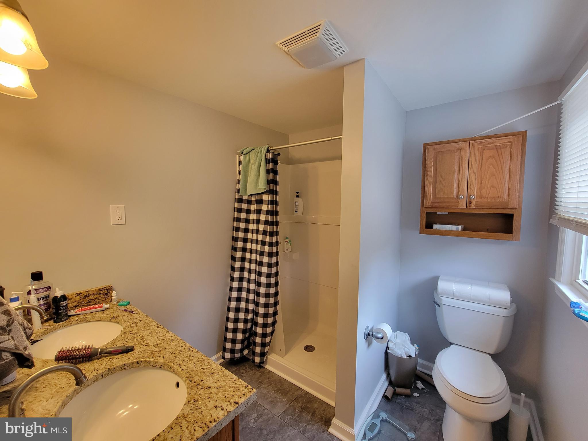 212 Cornell Road Glassboro, NJ 08028 - Photo 18 of 19 a bathroom with a sink toilet and shower