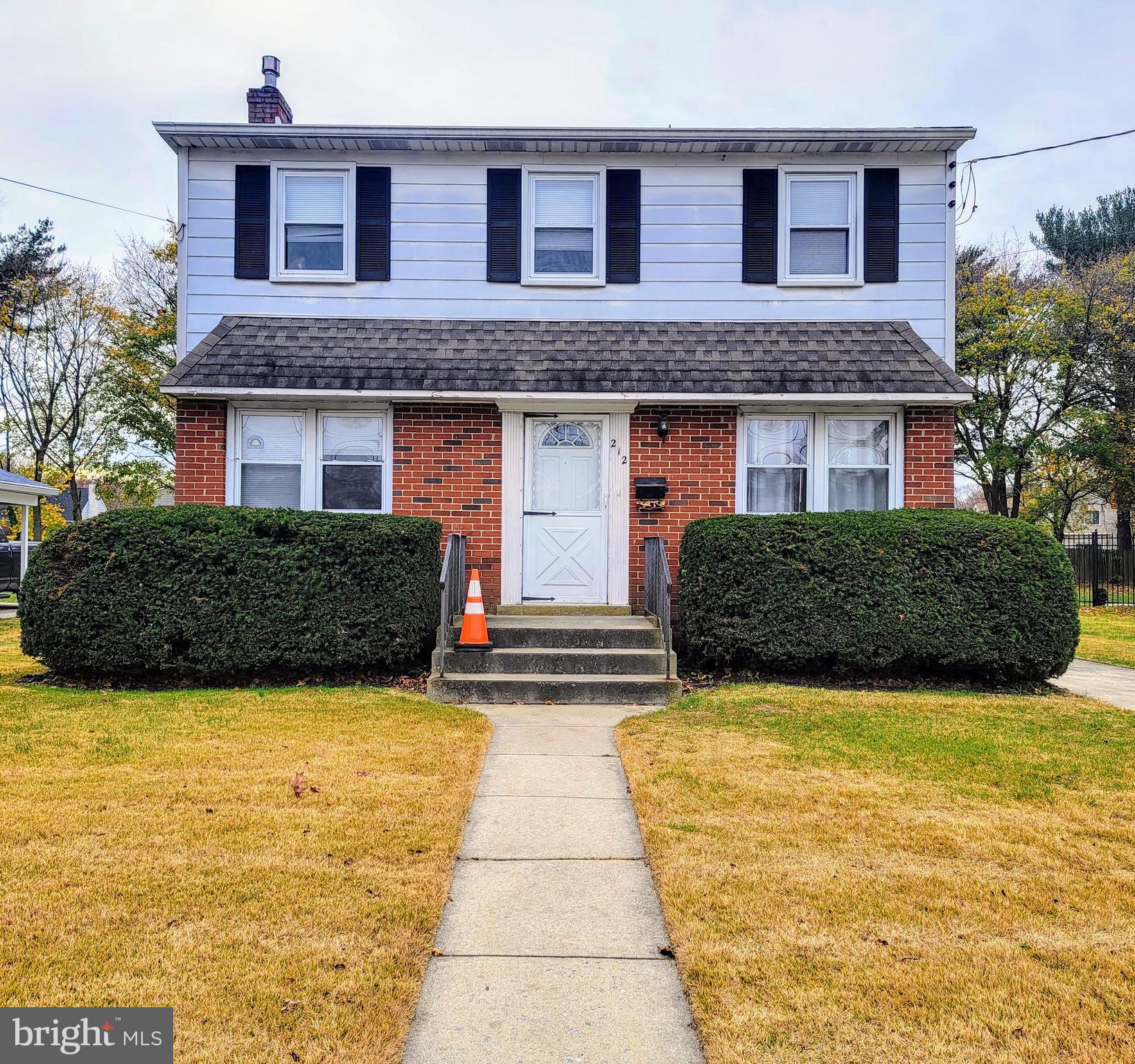 212 Cornell Road Glassboro, NJ 08028 - Photo 2 of 19 a front view of a house with yard and garage