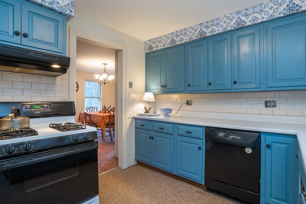 76 Amherst Road Pelham, MA 01002 - Photo 30 of 42 a kitchen with granite countertop wooden cabinets and a stove top oven