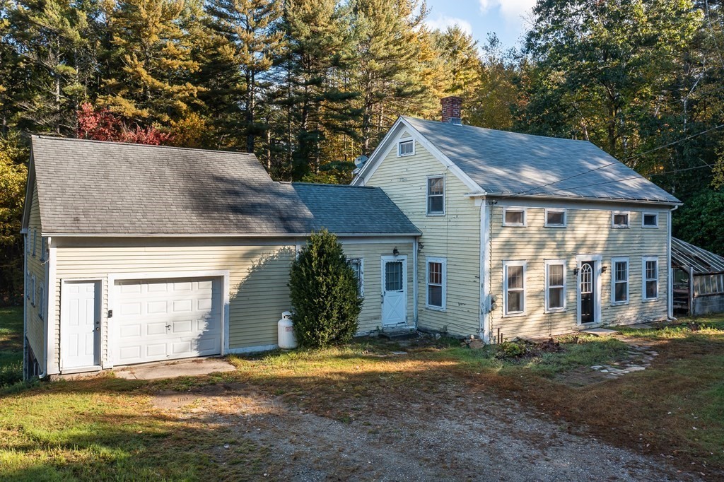 76 Amherst Road Pelham, MA 01002 - Photo 3 of 42 a front view of a house with garden