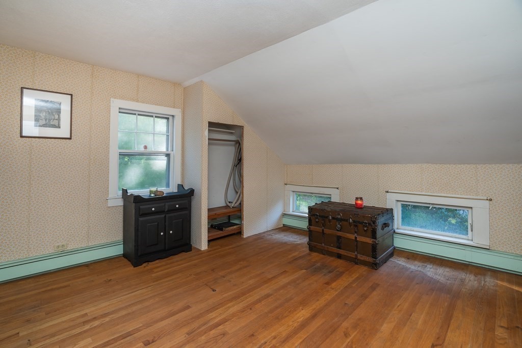 76 Amherst Road Pelham, MA 01002 - Photo 38 of 42 a living room with furniture and a flat screen tv