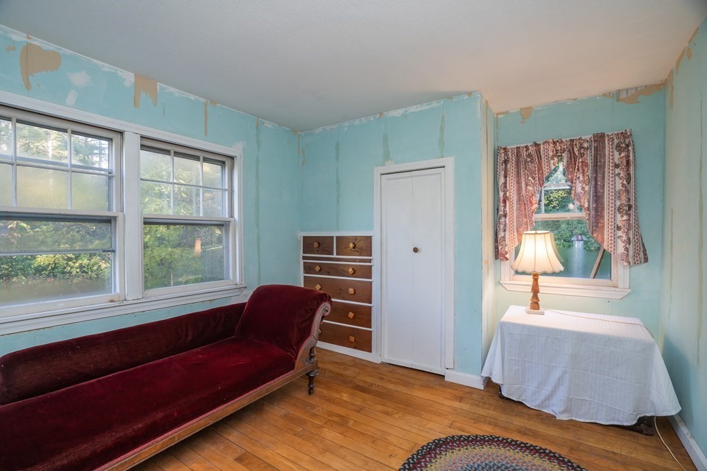 76 Amherst Road Pelham, MA 01002 - Photo 39 of 42 a living room with furniture and a window
