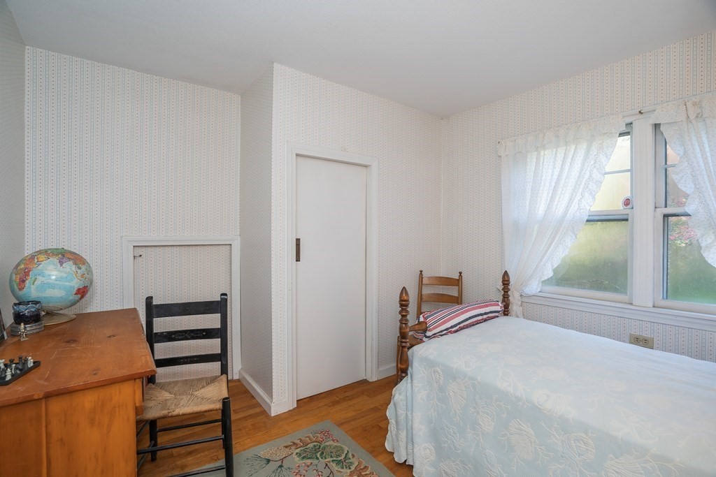 76 Amherst Road Pelham, MA 01002 - Photo 40 of 42 a bedroom with a bed and a window