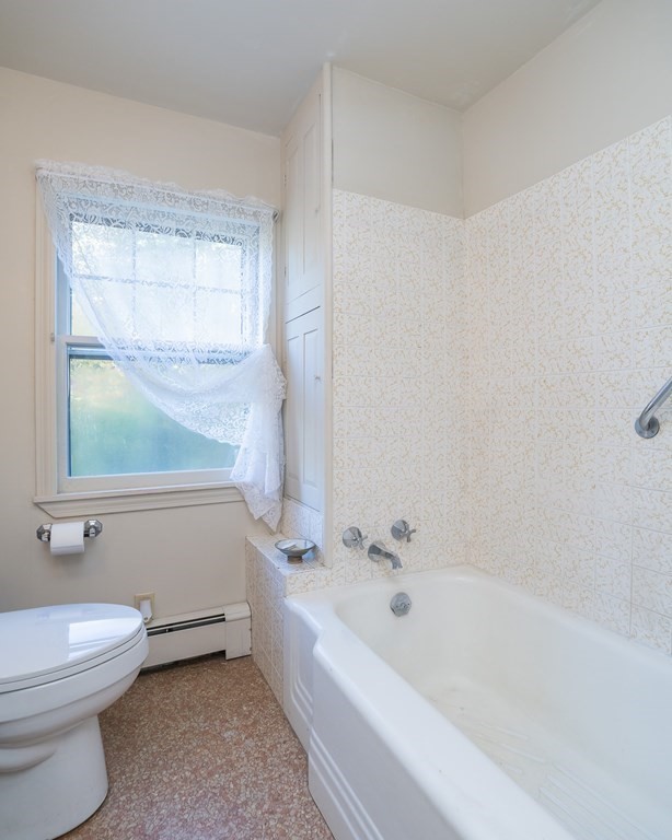76 Amherst Road Pelham, MA 01002 - Photo 41 of 42 a bathroom with a bathtub and a toilet