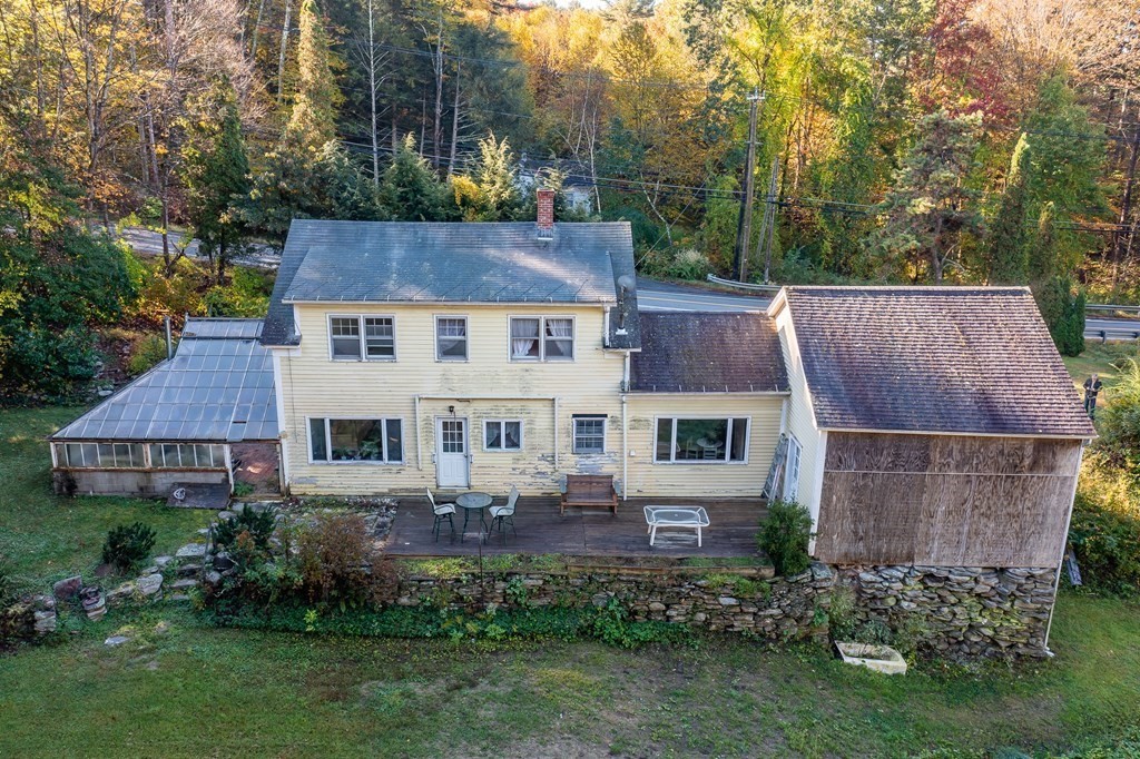 76 Amherst Road Pelham, MA 01002 - Photo 9 of 42 front view of a house with a garden