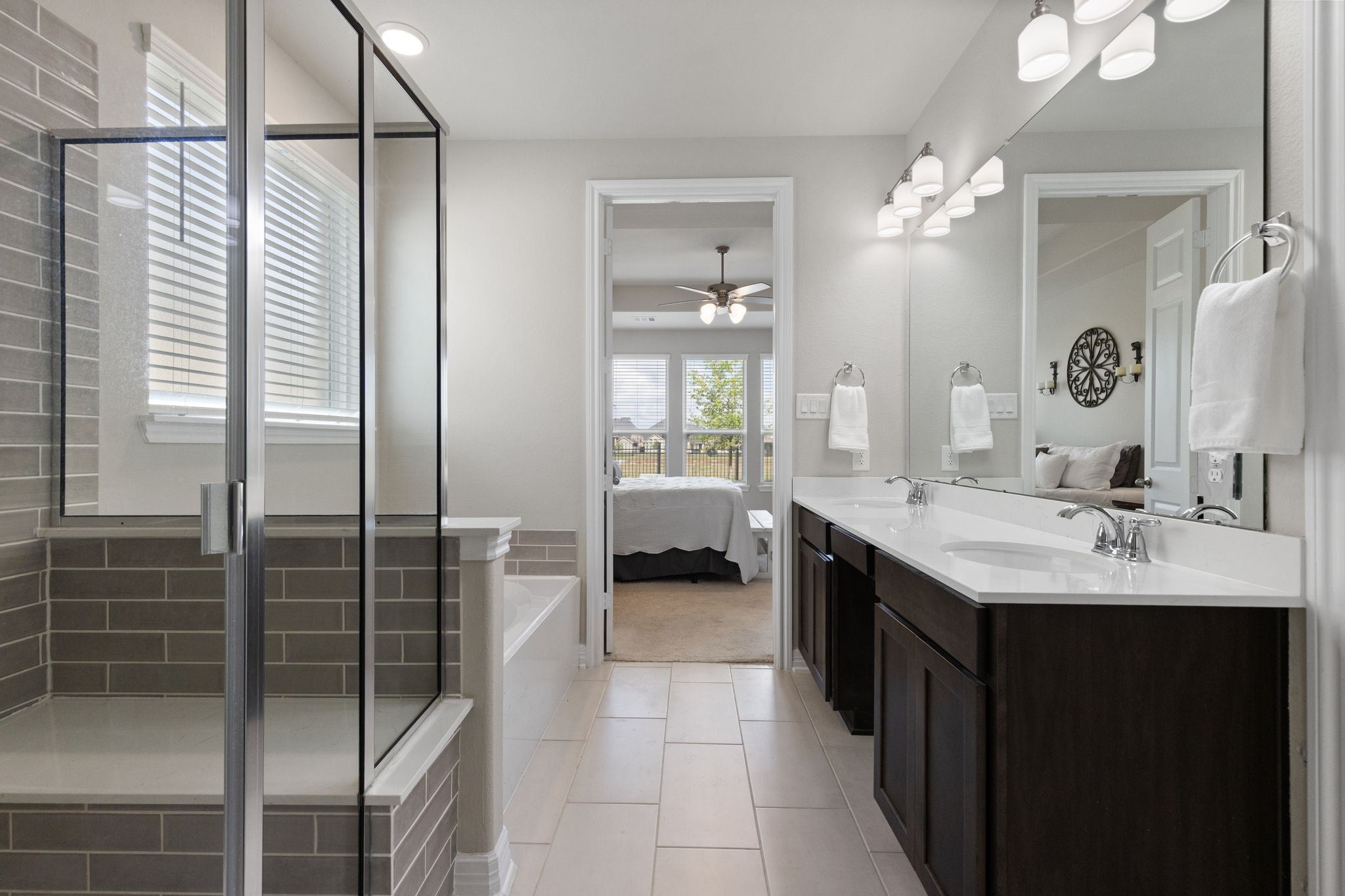 3541 Cherrybark Gable Ln Spring Spring, TX 77386 - Photo 18 of 39 Primary ensuite with dual vanities, a soaking tub and separate shower.