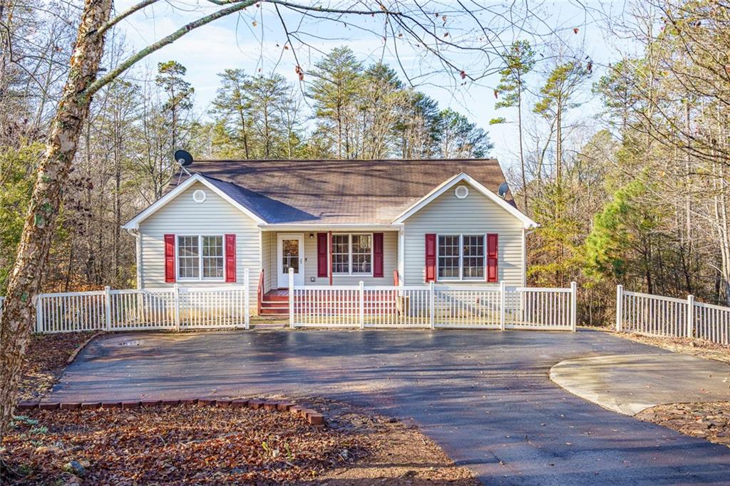 450 High Ridge Lane Dahlonega, GA 30533 - Photo 1 of 39 a front view of house with wooden deck and a yard