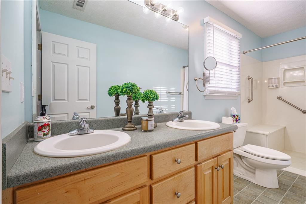 450 High Ridge Lane Dahlonega, GA 30533 - Photo 18 of 39 a bathroom with a sink and a mirror