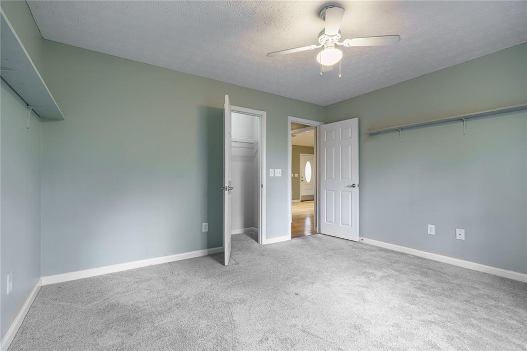 450 High Ridge Lane Dahlonega, GA 30533 - Photo 20 of 39 a view of an empty room and a ceiling fan window