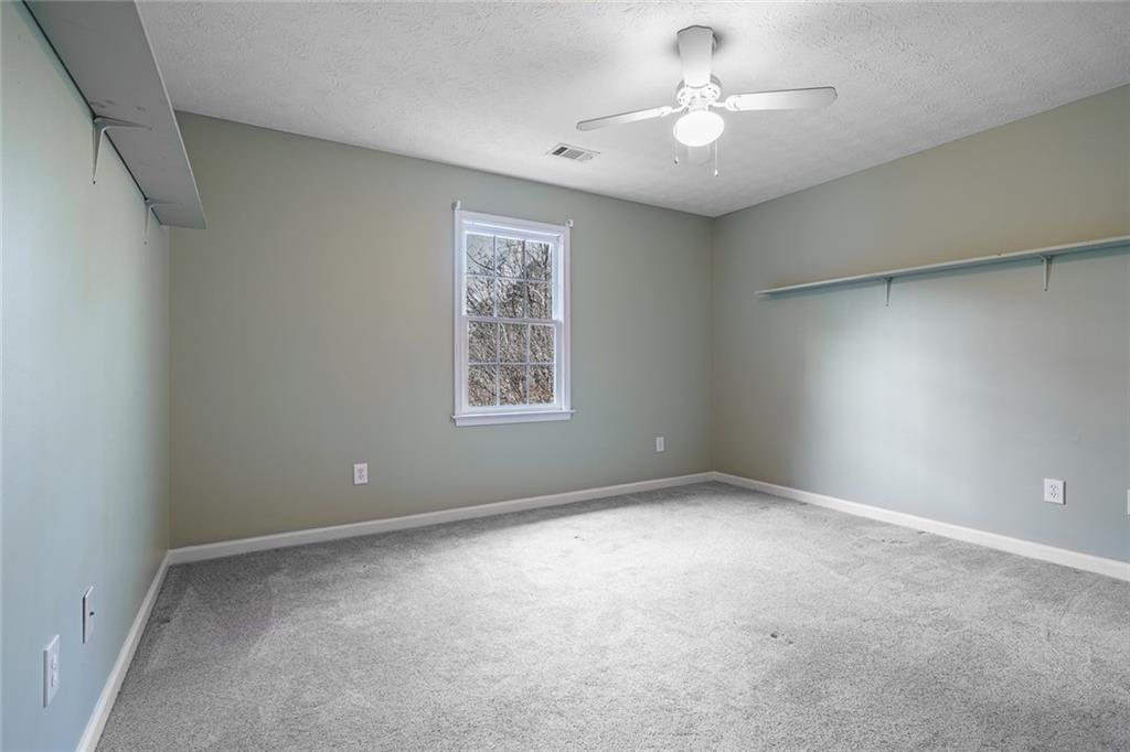 450 High Ridge Lane Dahlonega, GA 30533 - Photo 21 of 39 a view of an empty room with a window