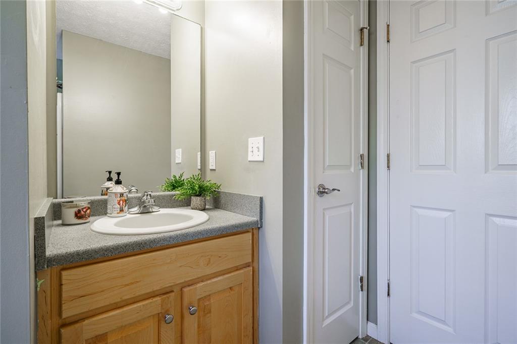 450 High Ridge Lane Dahlonega, GA 30533 - Photo 23 of 39 a bathroom with a sink and a mirror
