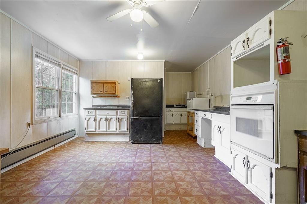 450 High Ridge Lane Dahlonega, GA 30533 - Photo 27 of 39 a kitchen with refrigerator and cabinets