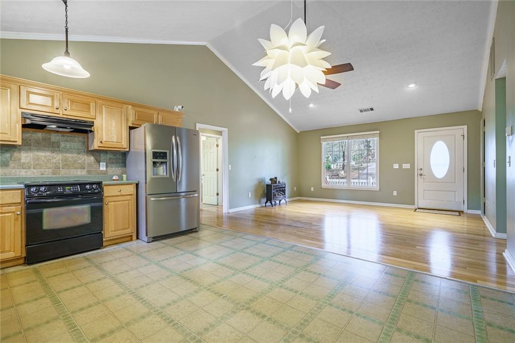 450 High Ridge Lane Dahlonega, GA 30533 - Photo 7 of 39 a view of a kitchen with a stove cabinets and a chandelier