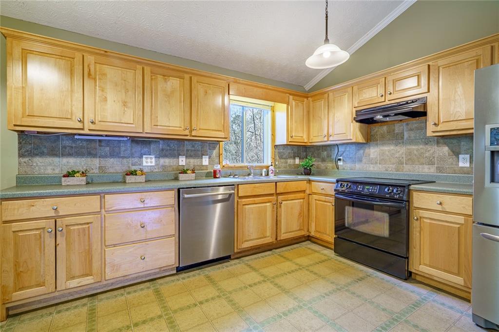 450 High Ridge Lane Dahlonega, GA 30533 - Photo 8 of 39 a kitchen with granite countertop cabinets stainless steel appliances and a window
