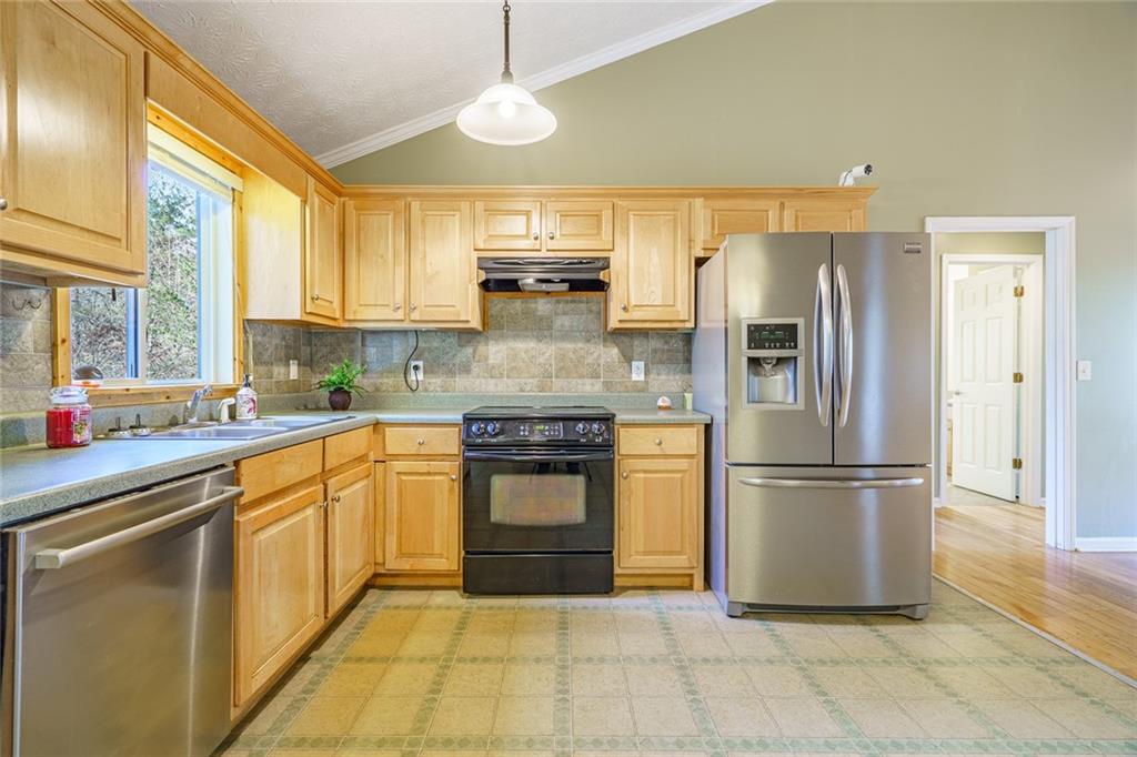 450 High Ridge Lane Dahlonega, GA 30533 - Photo 9 of 39 a kitchen with stainless steel appliances granite countertop a refrigerator a sink a stove and oven