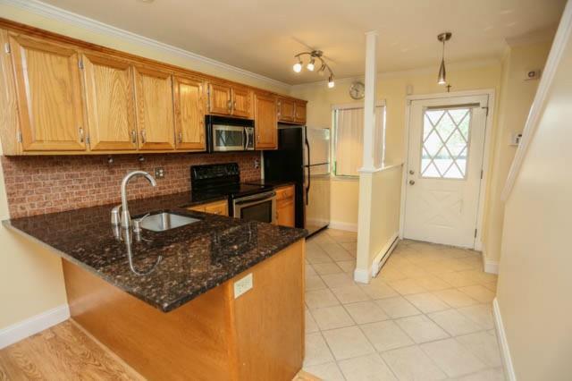 718 Cove Road, Unit 13 Stamford, CT 06902 - Photo 1 of 1 a kitchen with stainless steel appliances granite countertop a sink a stove and a refrigerator