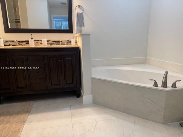 9021 Southwest 94th Street, Unit 708 Miami, FL 33176 - Photo 10 of 11 a bathroom with a bathtub and a sink