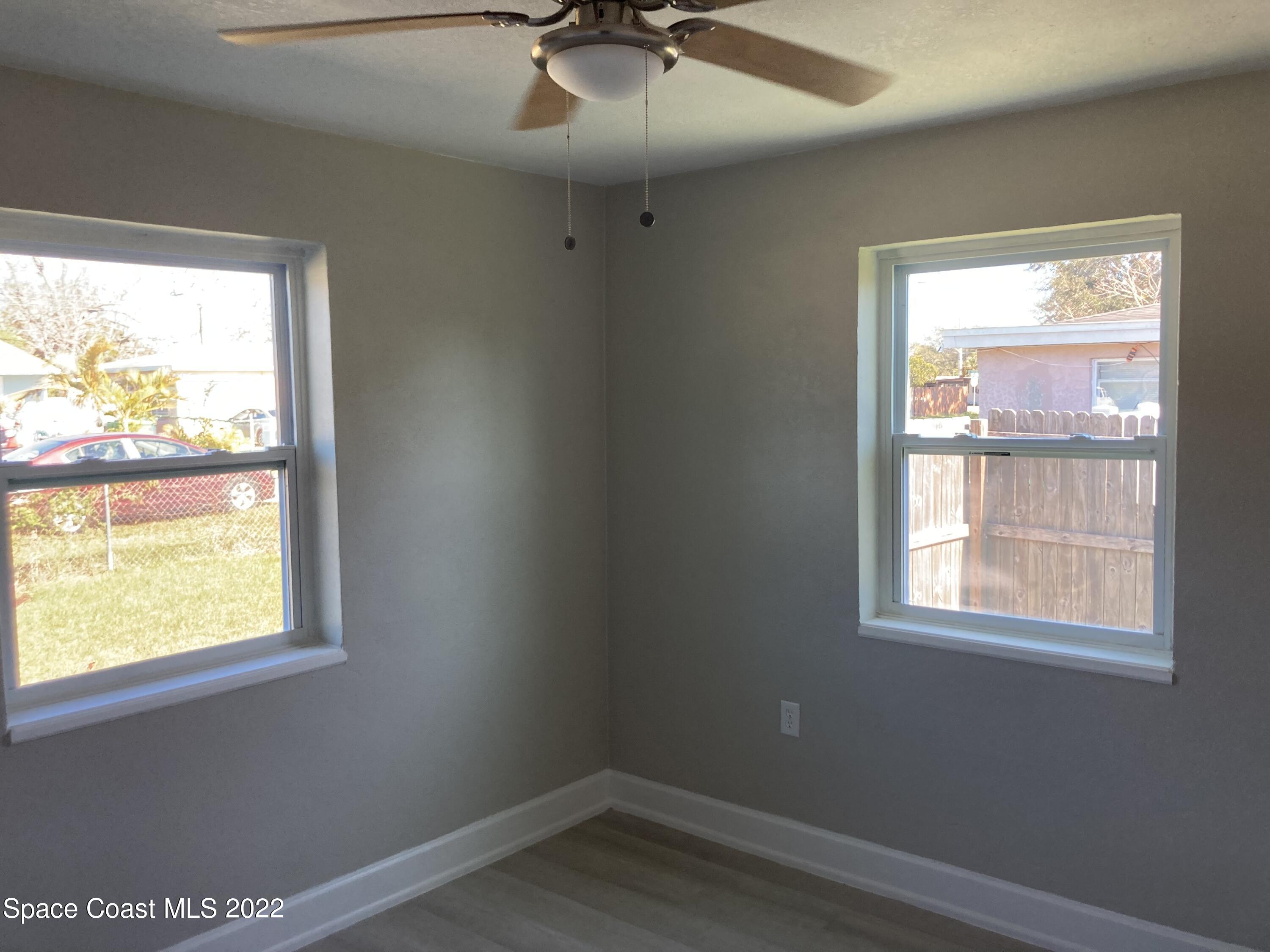 1051 Mitchell Street Cocoa, FL 32922 - Photo 12 of 21 an empty room with a window