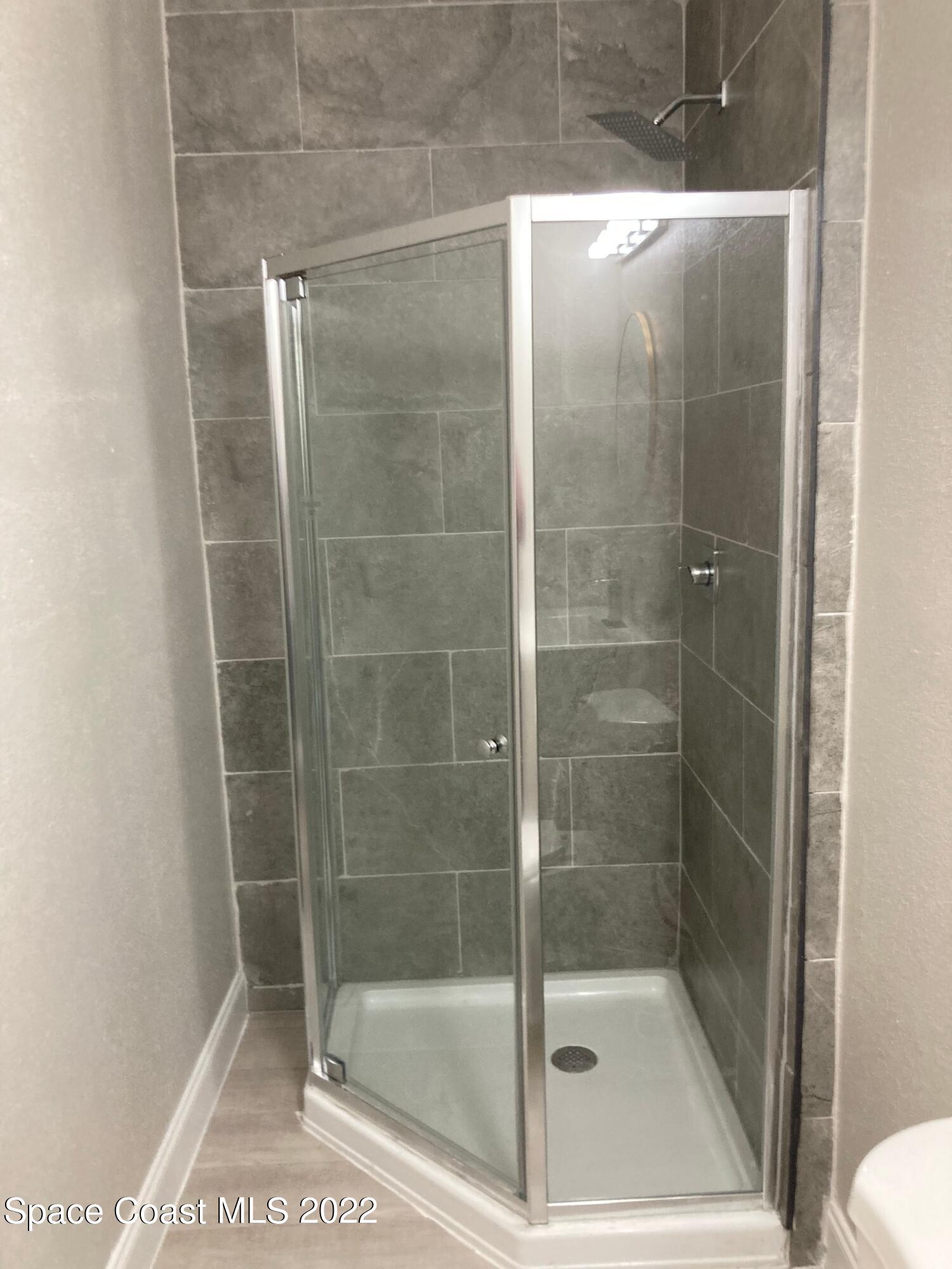 1051 Mitchell Street Cocoa, FL 32922 - Photo 16 of 21 a bathroom with a shower