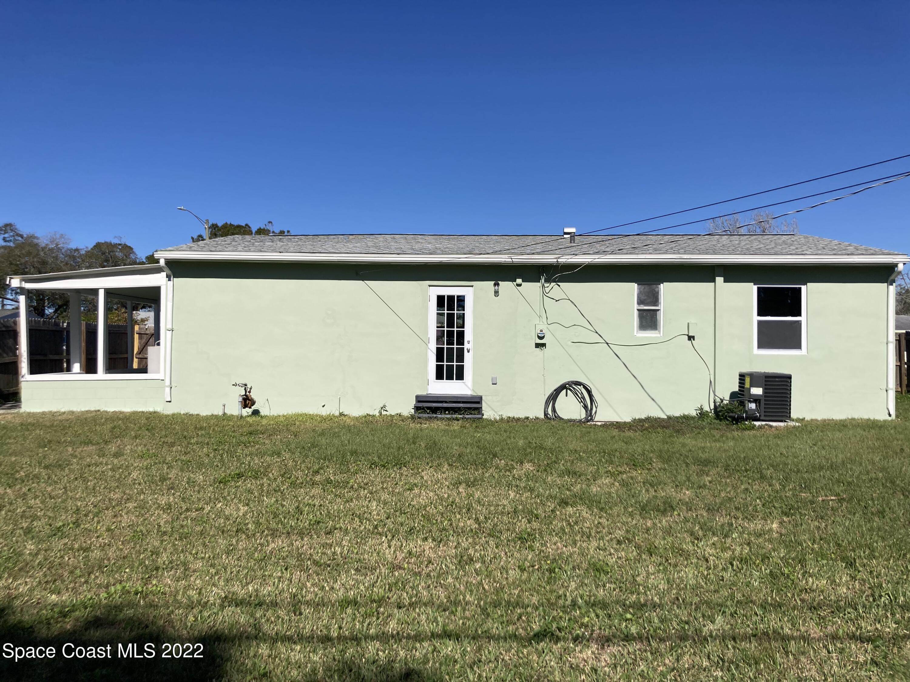 1051 Mitchell Street Cocoa, FL 32922 - Photo 18 of 21 a view of a back yard of the house