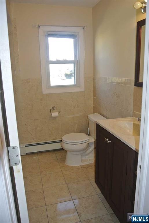 164 Scoles Avenue, Unit 2 Clifton, NJ 07012 - Photo 11 of 16 a bathroom with a sink a toilet and shower