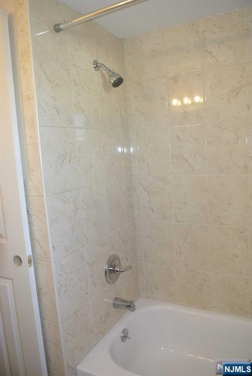 164 Scoles Avenue, Unit 2 Clifton, NJ 07012 - Photo 12 of 16 a bathroom with a bathtub