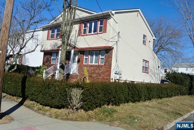 164 Scoles Avenue, Unit 2 Clifton, NJ 07012 - Photo 3 of 16 a view of a white building among the street