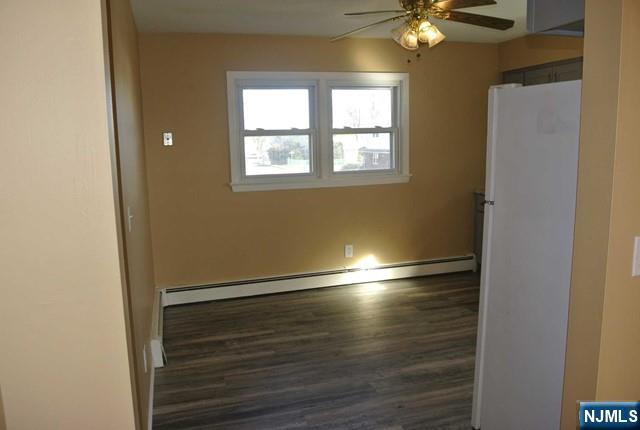 164 Scoles Avenue, Unit 2 Clifton, NJ 07012 - Photo 9 of 16 a view of empty room with wooden floor