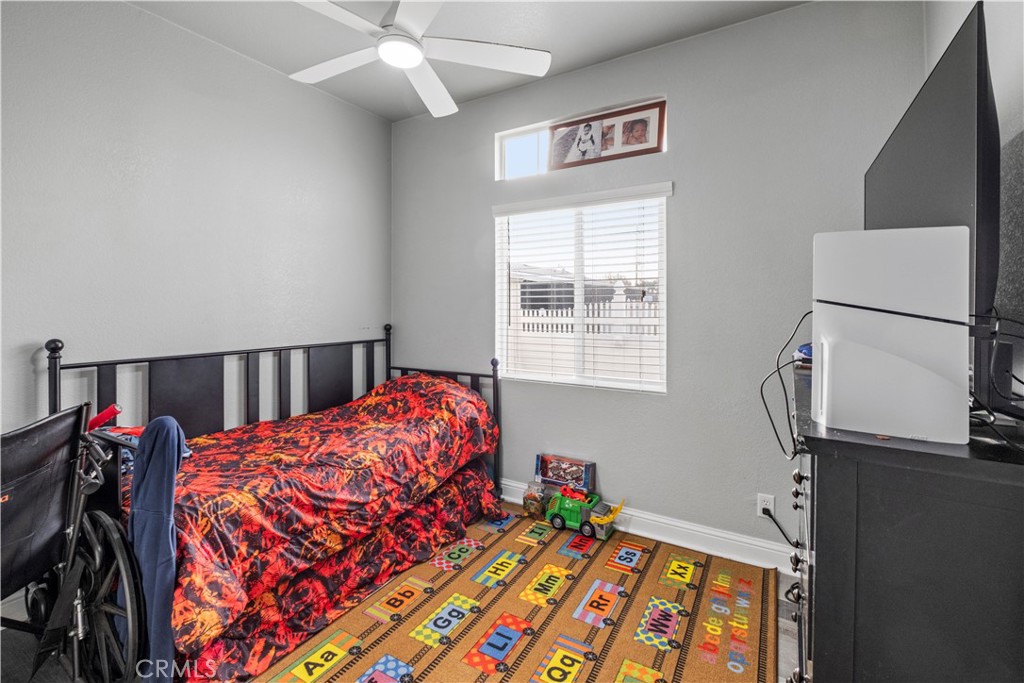 2139 East 4th Street, Unit 84 Ontario, CA 91764 - Photo 15 of 25 a bedroom with bed and a window